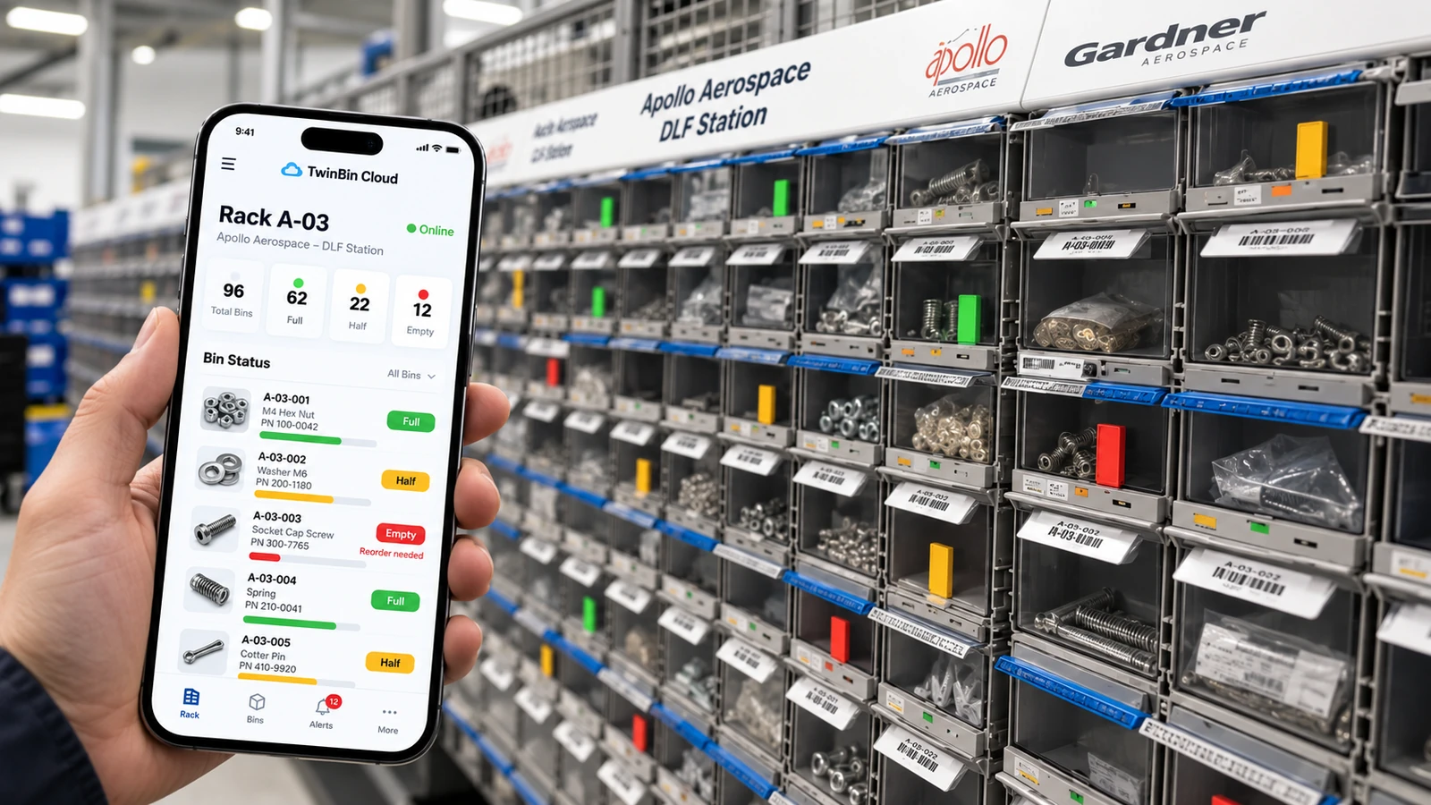The TwinBin Cloud mobile app showing live bin status — full, half and empty, with reorder alerts — against a wall of parts bins fitted with color indicator flags.